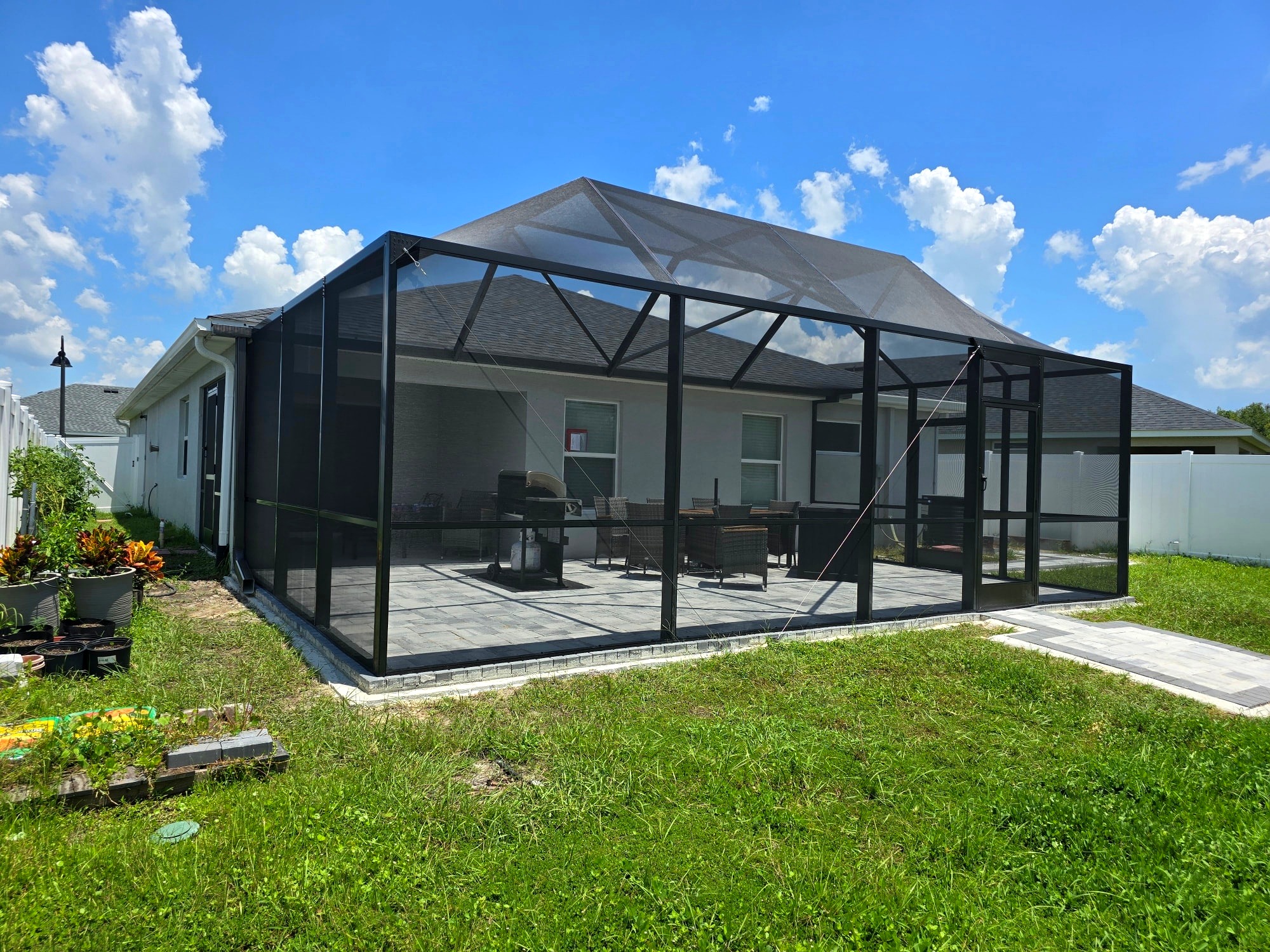 Gable screen enclosure over paver patio — Lutz, FL